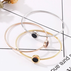 Stainless steel open bracelets in gold, rose gold and silver with black resin circle charm
