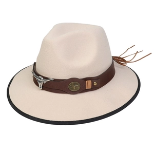 Close-up of beige cowboy hat with brown leather band and silver bull head ornament