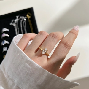 Detail of a pear-cut zircon stone set on a slim gold-plated S925 silver ring