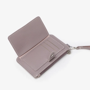 Purple leather zip coin purse with multiple card slots and a wrist strap on white background
