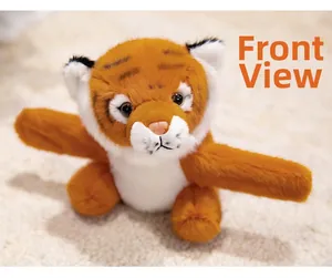Front view of an unfolded orange plush tiger slap bracelet toy on a soft beige rug