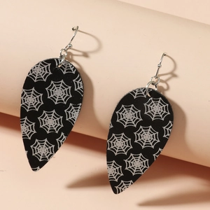 Macro detail of teardrop Halloween earrings with silver spider web print on black faux leather