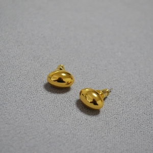 Minimalist golden bean stud earrings with polished mirror finish in oval shape