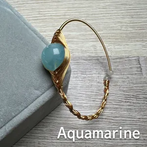 Handmade wire-wrapped 14K gold filled bracelet featuring a large round aquamarine stone