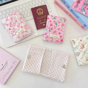 Detailed view of quilted cotton floral passport cover with secure metal magnetic closure