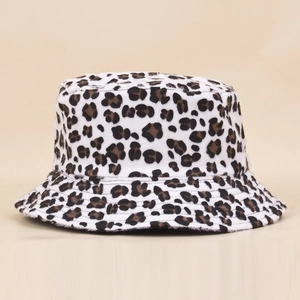 Detail showing the plush leopard print faux fur texture and flat crown of the bucket hat