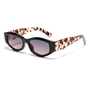 Retro polygon cat eye sunglasses with black frames and tortoiseshell temples for women