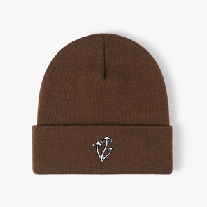 Brown knitted beanie hat with three white mushroom embroidery in a minimalist style