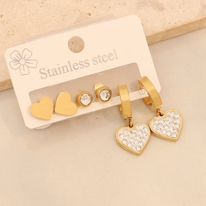 Three pairs of golden stainless steel earrings set with heart shapes and rhinestones