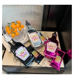 Creative condiment bottle shaped shoulder bags in black, silver, and magenta faux leather