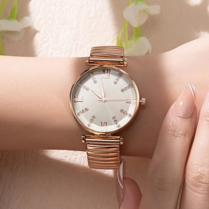 Women's rose gold quartz watch with Roman numerals and rhinestones on a stretch band