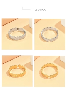 Detail showing hand-hammered texture on gold and silver adjustable steel rings