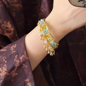 Ethnic style multi-layer beaded bracelet with gold wire wrap and small bell charms