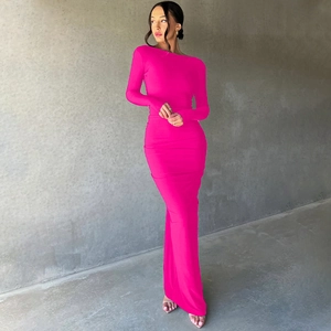 Detailed view of the slim-fit magenta long-sleeve dress with elegant ruching details