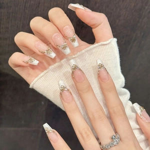Nude pink lace coffin press-on nails with golden butterflies and glitter accents