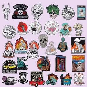 Set of creative gothic skull enamel pins with humorous slogans on a purple background