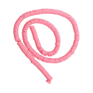 Detailed close-up of bright pink polymer clay heishi beads for DIY jewelry making