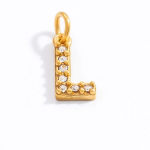 Macro shot of 18K gold plated letter L pendant with clear sparkling zircon stones