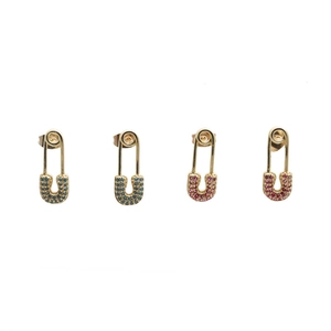 Detailed view of gold safety pin earrings with pave blue and pink cubic zirconia