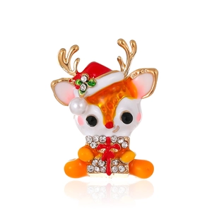 Christmas reindeer brooch with enamel finish and sparkling gift box on white background