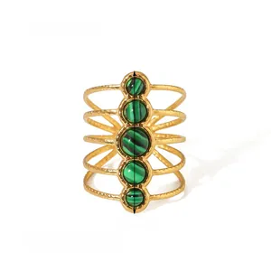 Detail of 27mm 18k gold-plated ring with five round emerald green natural stones
