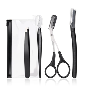 4-piece black stainless steel eyebrow grooming kit with scissors, tweezers, and comb