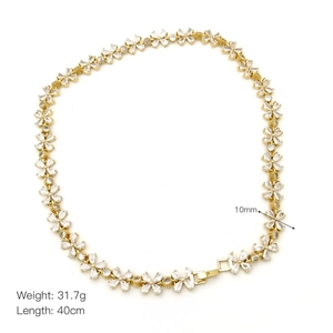 Detail of gold floral link necklace with zircon stones including 40cm length and weight info