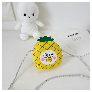 Detailed view of yellow pineapple kid crossbody bag with cute duck face and green leaves