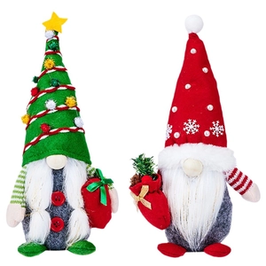 Set of two festive Christmas gnomes with green tree and red snowflake hats for decor