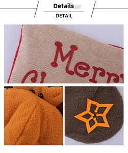Detail of Santa stocking with Merry embroidery, 3D reindeer doll, and linen textures