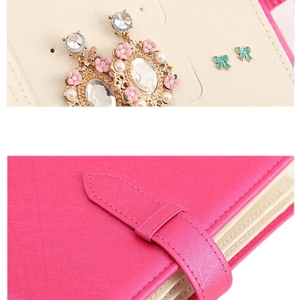 Portable rose red leather jewelry organizer book with flower earrings and bow studs