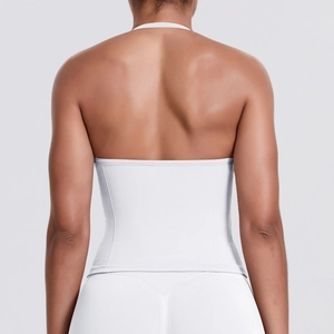 Close-up back view of a white seamless stretch sports bra showing tight fit and elastic texture
