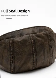 Detail view of the seamless back and vintage faux leather texture of a brown beret cap