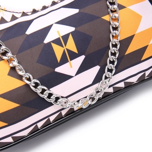 Detail showing geometric Aztec print and silver chain on Bohemian shoulder bag