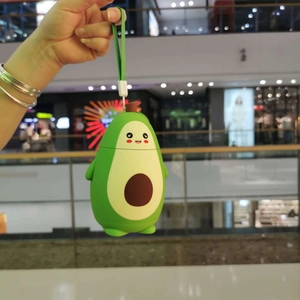 Close-up of cute green avocado hand warmer with silicone finish and hanging strap