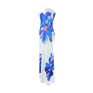 Detail view of white strapless maxi dress featuring vibrant blue floral patterns