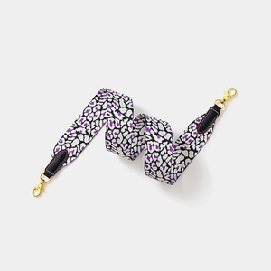 Adjustable leopard print wide shoulder strap with black leather ends and gold metal clips
