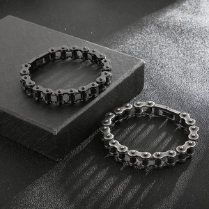 Close-up of 11mm industrial bicycle chain bracelets in black and silver metallic finishes