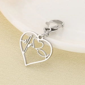 Macro detail of silver stethoscope heart pendant with lobster clasp and hollow design