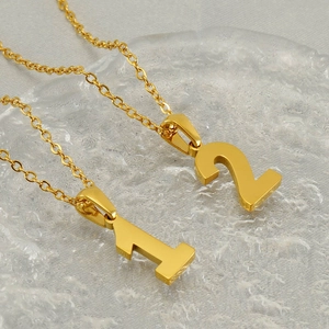 Gold stainless steel number necklaces featuring digit pendants 1 and 2 on O-shaped chains