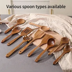 Natural acacia wood kitchen utensil set including spatulas and spoons with hanging holes