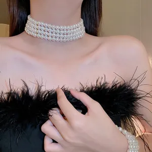 Luxurious four-layer pearl choker necklace and bracelet set with golden clasps