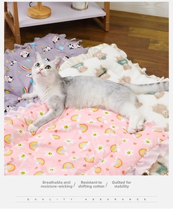 Close-up of quilted pet sleeping mats with decorative ruffle edges in three cute patterns