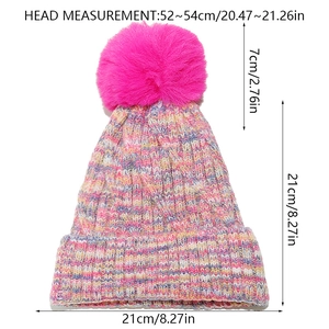 Detailed dimensions of a rainbow knit beanie with pink faux fur pom and folded cuff