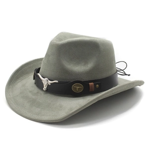 Detail of grey suede cowboy hat featuring a black leather band and silver bull head emblem