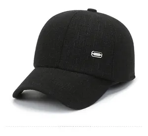 Detail view of black wool baseball cap with a textured tweed finish and side metal buckle
