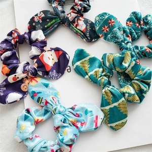 Detail of Christmas scrunchie set with festive bunny ear patterns in soft velvet fabric