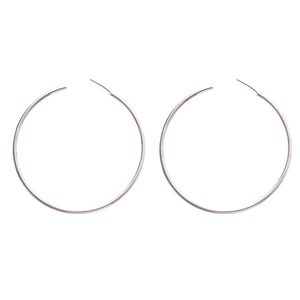 Polished silver oversized round hoop earrings with pin closure on white background
