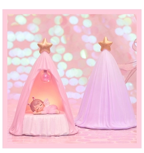 Detail of pink starry tent night light with sleeping angel and warm glowing effect