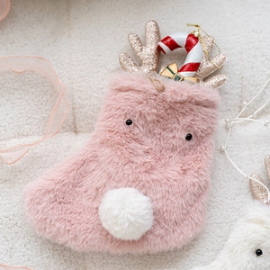 Pink plush Christmas stocking with sequined reindeer antlers and candy cane charm